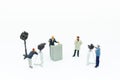 Miniature people: Moderator are interviewing businessman with camera and video capture. Image use for Entertainment Industry