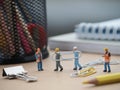 Miniature of people on the office desk. Worker conceptual design. Royalty Free Stock Photo