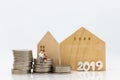 Miniature people, Old couple figure sitting on top of stack coins using as background retirement planning, Life insurance concept Royalty Free Stock Photo