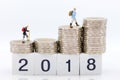 Miniature people: Old people standing on top of stack coins . Image use for background retirement planning, Life insurance concept Royalty Free Stock Photo