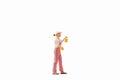 Miniature people, painter holding paint brush on white background with clipping path Royalty Free Stock Photo