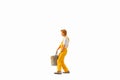 Miniature people, Painter holding paint bucket on white background with clipping path Royalty Free Stock Photo