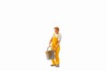 Miniature people, Painter holding paint bucket on white background with clipping path Royalty Free Stock Photo