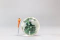 Painters are polishing a crystal globe, and the concept of World Earth Day