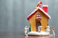 Miniature people painting house and Santa Claus sitting on the r Royalty Free Stock Photo