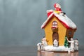 Miniature people painting house and Santa Claus sitting on the r Royalty Free Stock Photo