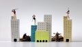 Miniature people playing golf on miniature buildings and Miniature people between miniature buildings.