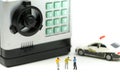 Miniature people : Police with criminal thief opens the safe stealing money from bank