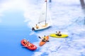 Miniature people, Rowing boat in the ocean. Image use for sports concept
