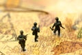 Miniature people : soldiers team with world map,War, army, military, guard concept.