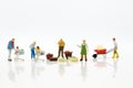 Miniature people : Spending cash for shopping in the market. Image use for marketing, merchant middleman,retail business concept
