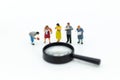 Miniature people: Students read books with magnifying glass . Image use for education concept