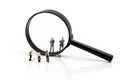 Miniature people : Successful businessman with magnifying glass of young businessman,Business Growth concept