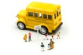 Miniature people : teacher and student with colorful drawing tools and stationary of school bus,education concept Royalty Free Stock Photo