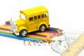 Miniature people : teacher and student with colorful drawing tools and stationary of school bus,education concept Royalty Free Stock Photo