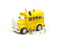 Miniature people : teacher and student with colorful drawing tools and stationary of school bus,education concept Royalty Free Stock Photo