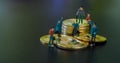 Miniature people teamworks, small model human figure standing and sitting on golden Bitcoins stack with copyspace for your text. Royalty Free Stock Photo