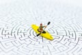Miniature people: tourist boating, kayaking on the maze. Image use for Adventure, activity, travel concept