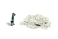 Businessmen using binoculars looking money cash paper pile from far