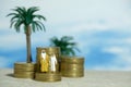 Miniature people toy figure photography. Wealth and heir of throne concept. A King Sultan with his son standing above gold coin