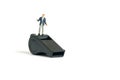 Miniature people toy figure photography. Whistle blower concepts. A shrugging businessman standing above black whistle. Isolated Royalty Free Stock Photo