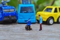 Miniature People and toys: Worker at the construction with chery picker truck background Royalty Free Stock Photo