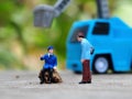 Miniature People and toys: Worker at the construction with chery picker truck background Royalty Free Stock Photo