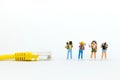 Miniature people : Travel with LAN cable. Image use for searching travel information via the Internet network.