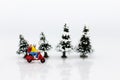 Miniature people :Traveler driving motorcycle in winter season. Image use for travel concept.