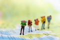 Miniature people : traveler walking on the map Thai language. Used to travel to destinations on travel business background concept Royalty Free Stock Photo