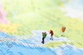 Miniature people : traveler walking on the map Thai language. Used to travel to destinations on travel business background concept Royalty Free Stock Photo