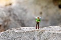 Miniature people : traveler walking on the road. Used to travel to destinations on travel business background concept Royalty Free Stock Photo
