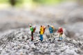Miniature people : traveler walking on the road. Used to travel to destinations on travel business background concept Royalty Free Stock Photo