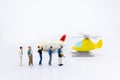 Miniature people: travelers with backpack standing on world map travel by plane. Image use for travel business concept Royalty Free Stock Photo