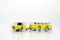 Miniature people: travelers with backpack standing on world map travel by van. Image use for travel business concept Royalty Free Stock Photo