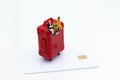 Miniature people : Travelers with red suitcase and credit card. Image use for travel, business concept Royalty Free Stock Photo