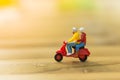 Miniature people : Travelers riding motorcycle on the road using