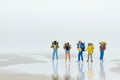 Miniature people: Travelers standing on a world map. Image use for travel , business concept Royalty Free Stock Photo