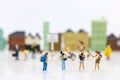 Miniature people: Traveller with backpack walking on the path of tourism. Travel, explore and adventure concept Royalty Free Stock Photo