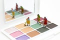 Miniature people: Women cleaning tools, eyeshadow. Image use for the beauty, cosmetic product