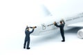 Miniature people : worker or Housewife cleaning on air plane us