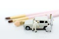 Miniature people : Worker make up the car. Image use for cleaning and maintenance, business autocar concept Royalty Free Stock Photo