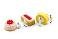 Miniature people : Worker painting with Sweet dessert,cooking and decoration concept