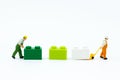 Miniature people: Worker use pallet truck with the colorful boxes. Image use for background business of warehouse concept Royalty Free Stock Photo