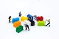 Miniature people: Worker use tools with the colorful boxes for repair. Image use for background business of maintenance, service Royalty Free Stock Photo