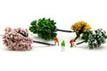 Miniature people : worker using a chainsaw to cut down a large beech tree, Deforestation concept Royalty Free Stock Photo