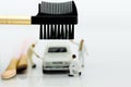 Miniature people : Workers make up the car. Image use for cleaning and maintenance, business autocar concept Royalty Free Stock Photo