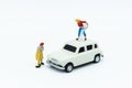 Miniature people : Workers make up the car. Image use for cleaning and maintenance, business autocar concept