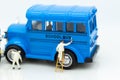 Miniature people : Workers make up the car. Image use for cleaning and maintenance, business autocar concept Royalty Free Stock Photo