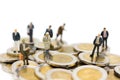 Miniature person: Businessman standing on stack of coins. Image use for business, financial concept